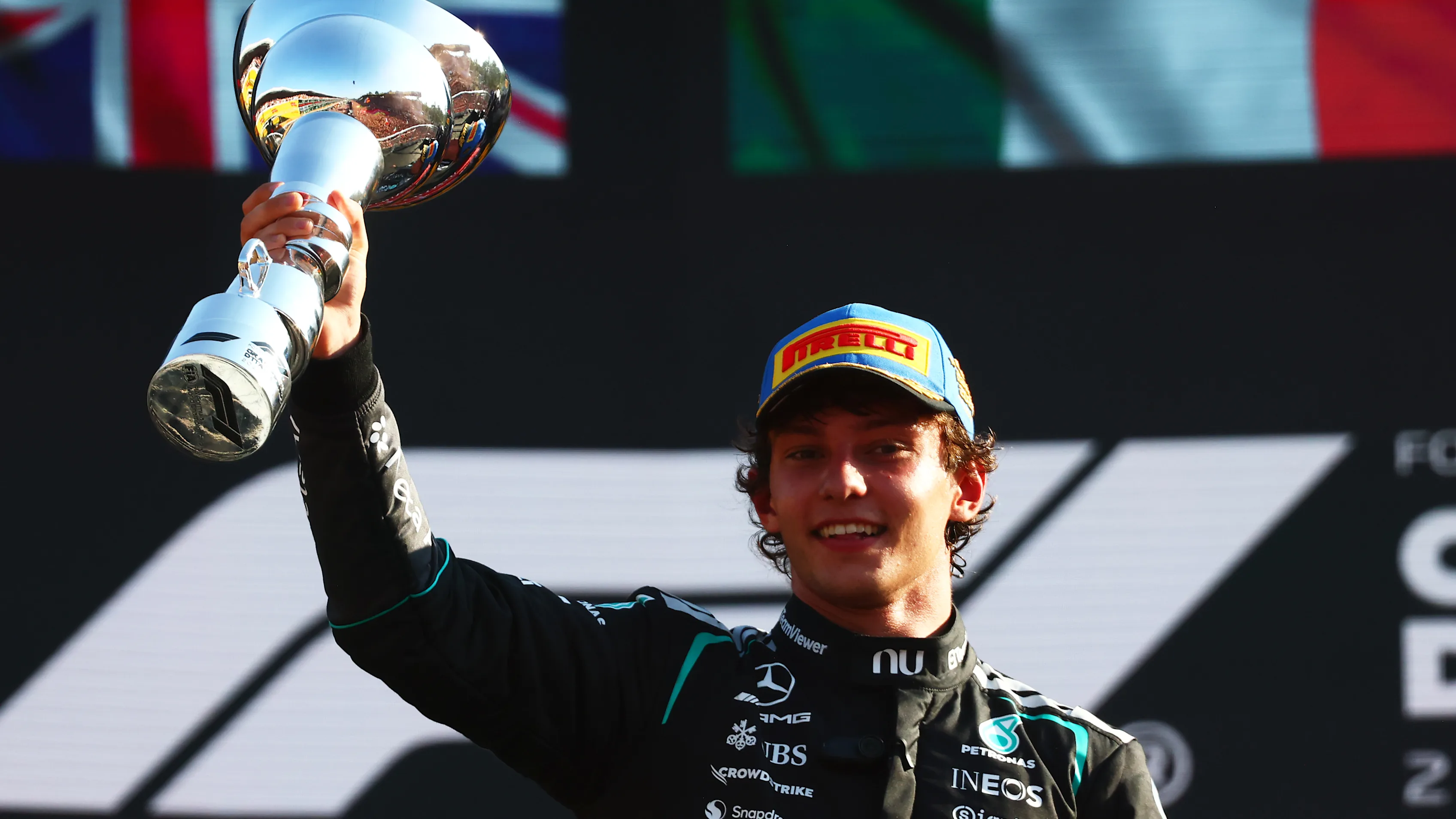 Kimi Antonelli raises the winner's trophy after the 2026 Italian Grand Prix.