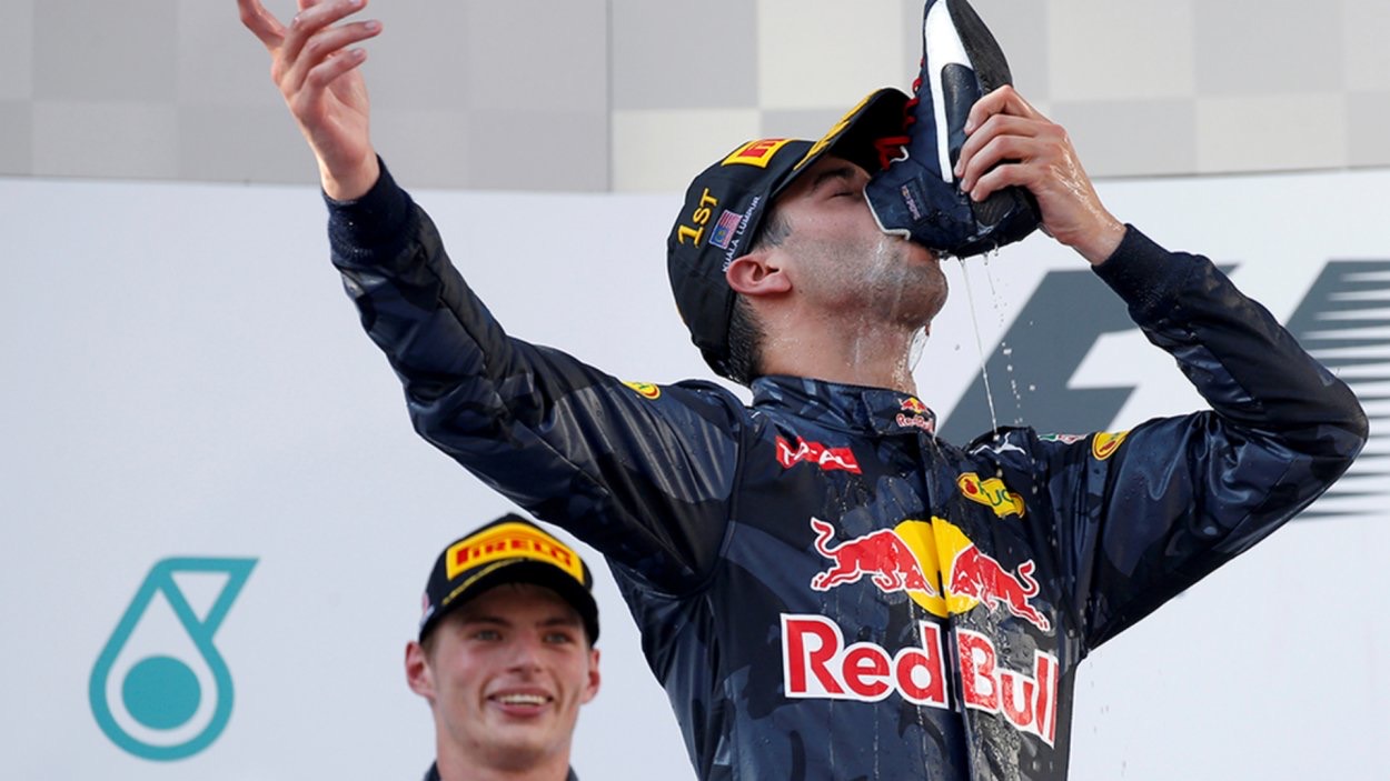 Daniel Ricciardo Shoey with Max Verstappen in background